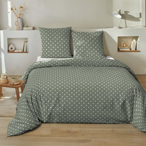 Parure coton 57 fils pression à pois coloris vert sauge dans une chambre lumineuse et épurée