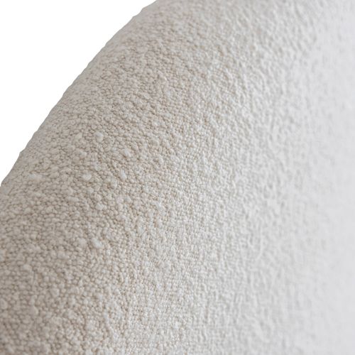 Gros plan sur la texture du tissu beige bouclette de l'ensemble de lit